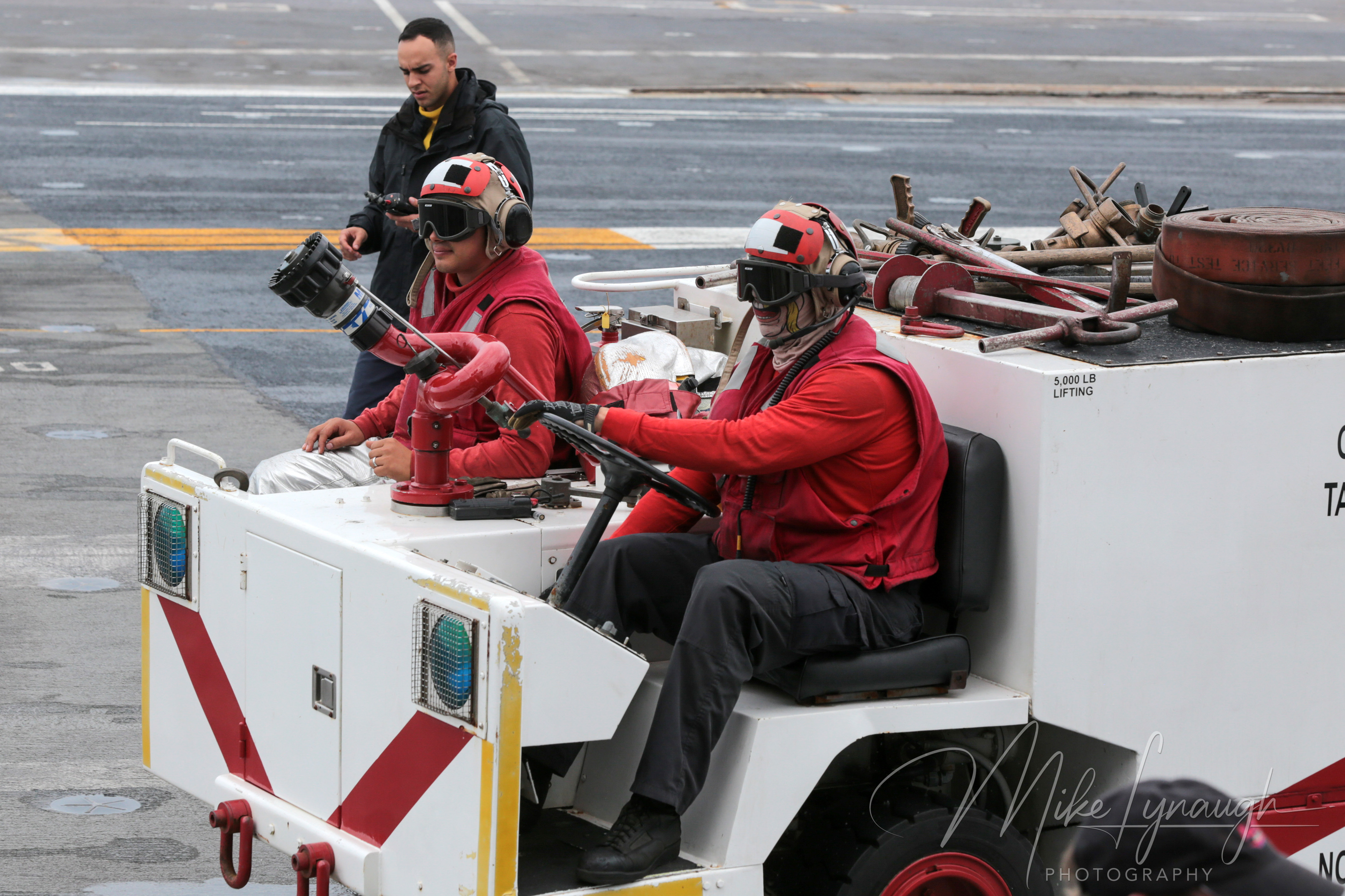 Sailors aboard an aircraft carrier