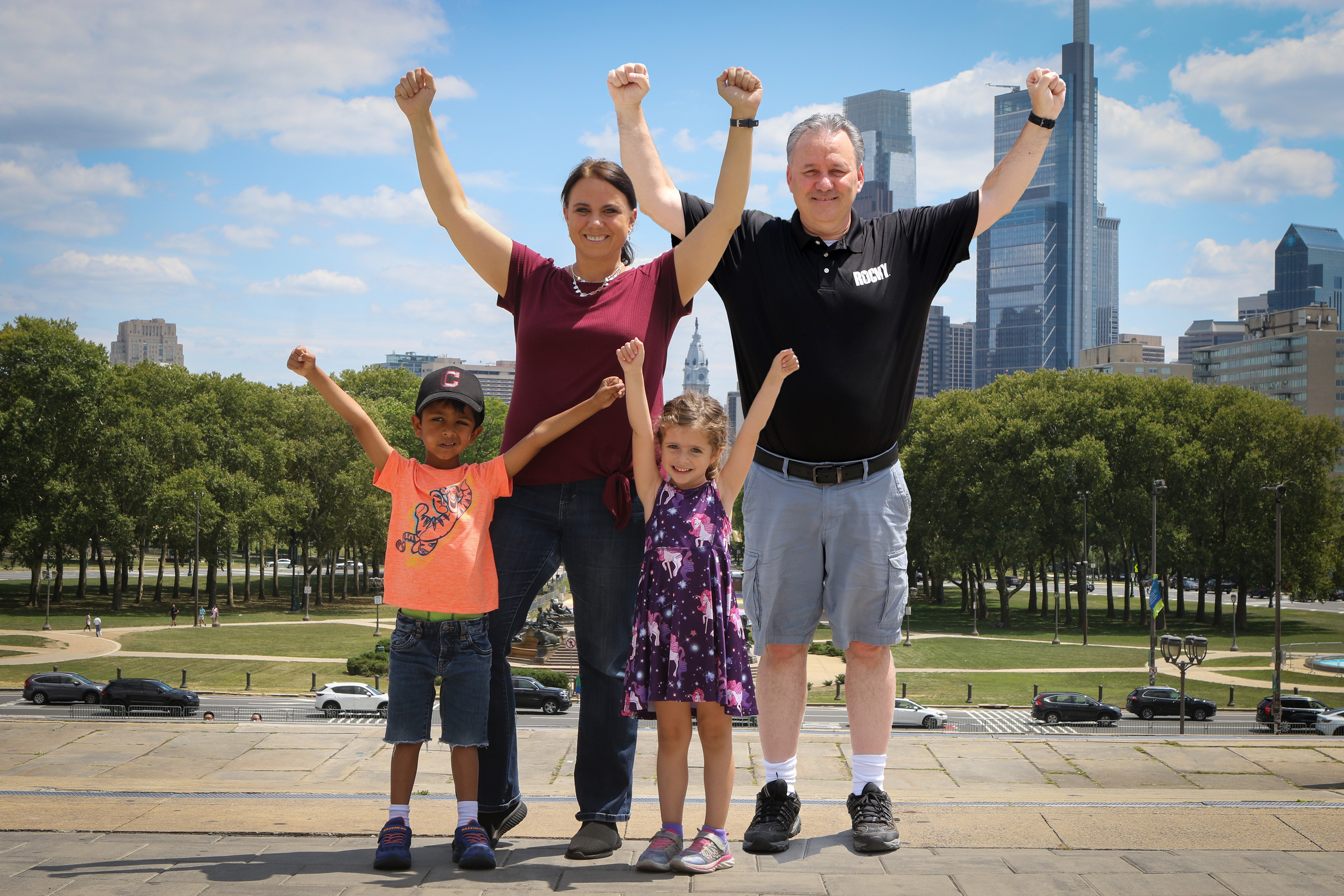 Our family striking the Rocky pose at the top of the Rocky Steps in 2021