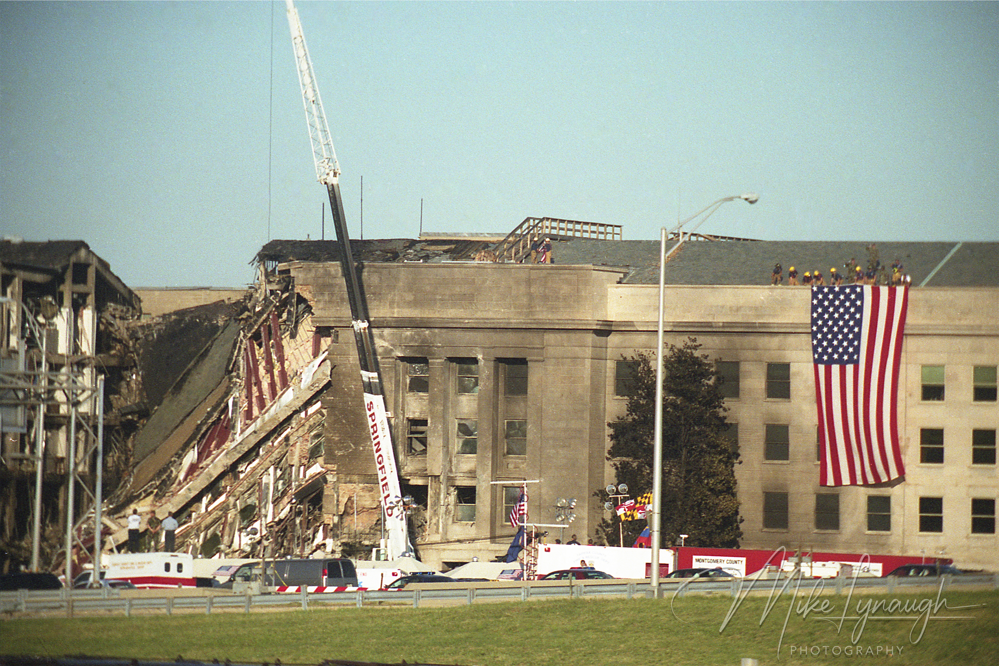 American flag hanging from the damaged Pentagon after September 11, 2001
